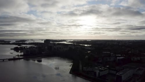 Arial view of coastal city during sunset.