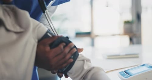 Doctor, patient and blood pressure at the hospital for appointment, checkup