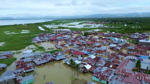Aerial View of Flooded Village by the Lake