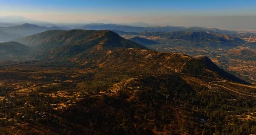 Aerial View of Rolling Mountains and Verdant Forests