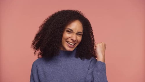 Woman Reacts with Excitement and a Fist Pump