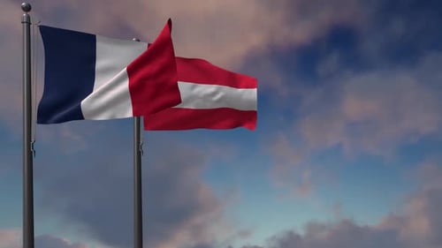 Waving Flags of France and Austria Against a Blue Sky
