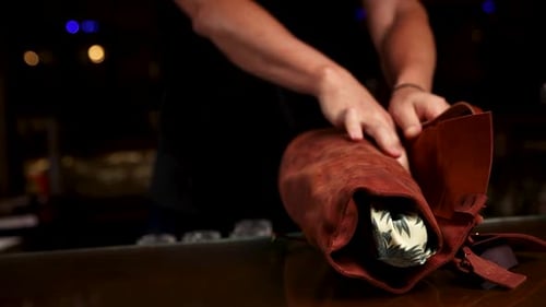the bartender prepares a cocktail at the bar