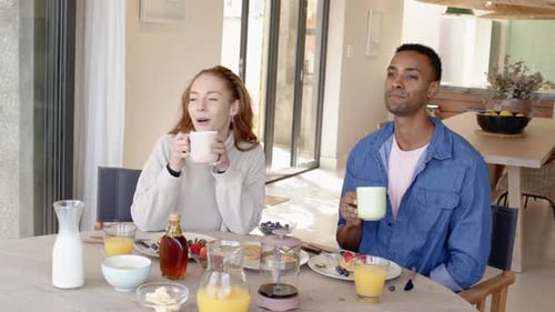 Young Adults Enjoying Breakfast at Home