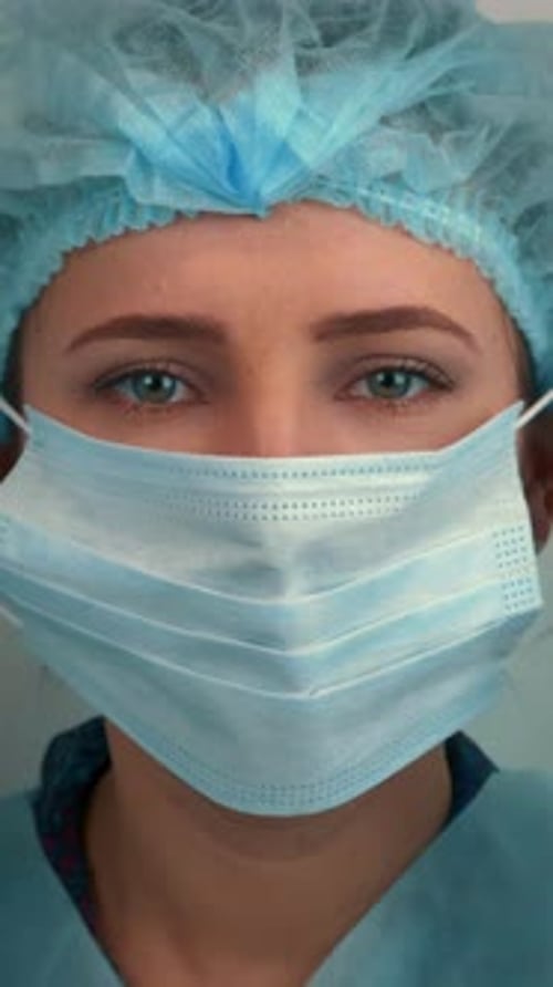 Healthcare Worker Adjusting Face Mask in Hospital