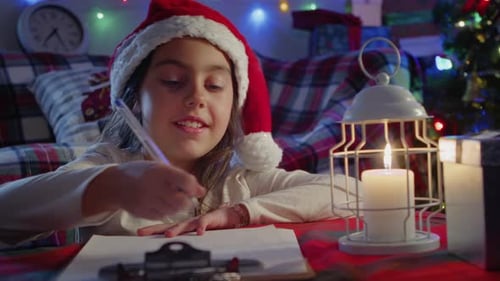 Girl Writes Letter to Santa for Christmas Eve