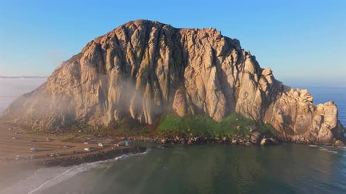 Experience the Stunning Aerial Views of the Iconic Coastal Rock Formation Along the Shoreline