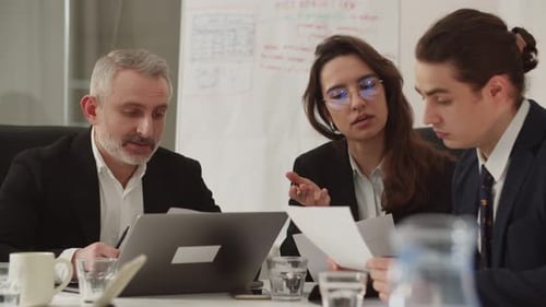 Intense Office Meeting With Colleagues Discussing Business