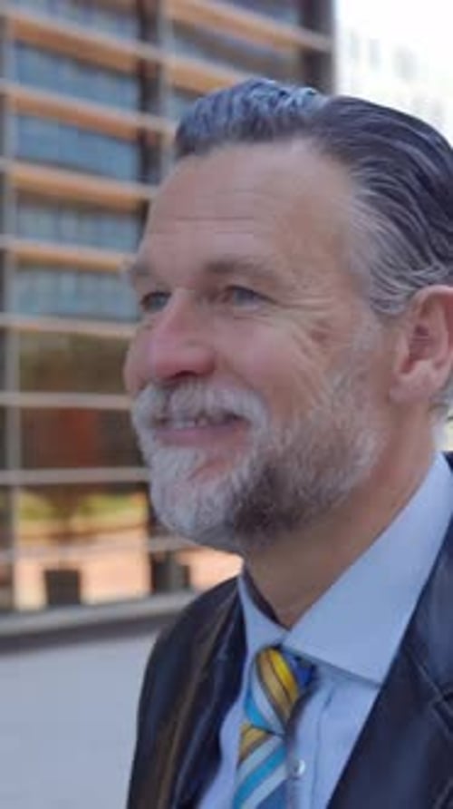 Confident Mature Professional Corporate Man Smile at Camera While Walk Outdoors