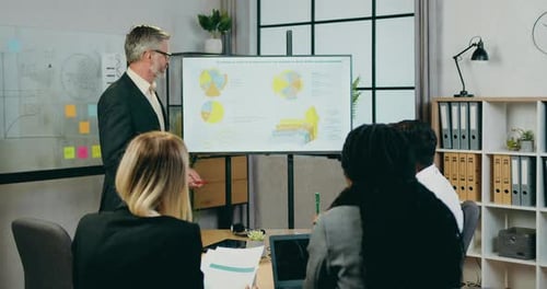 Business Presentation with Team in Modern Office