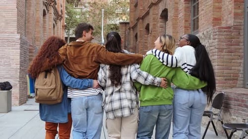 Diverse Group of Friends Walking with Arms Around Each Other