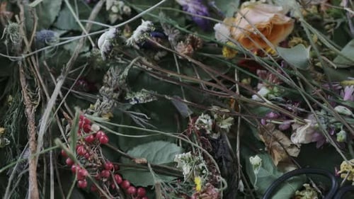 Dried floral arrangement with garden berries and rose