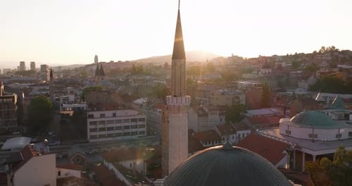 Gazi Husrev-beg Mosque Minaret At Sunset In The City Of Sarajevo, Bosnia and Herzegovina. Aerial