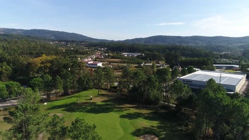 Flying over golf club Beautiful golf playground field with hills 4k