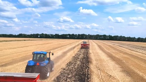 Aerial View of Tractor Plowing Ground