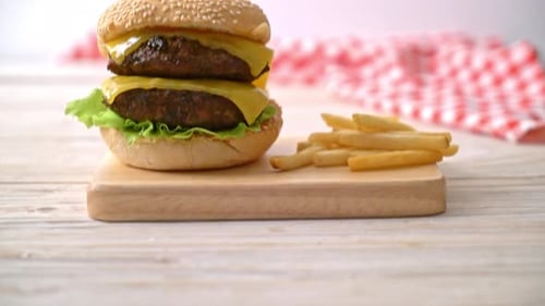Double Cheeseburger With Fries on Cutting Board