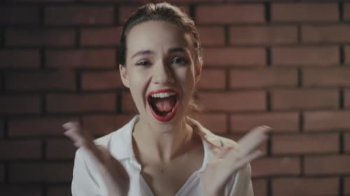 Exited Woman Laughing And Rejoicing Good News On Brick Wall Background. Successful Winner Girl En...