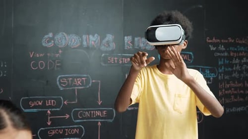 Boy wear headset to enter in metaverse while student write program. Edification
