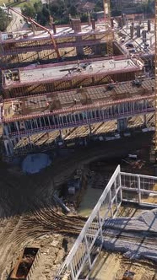 Vertical Video of Construction Workers in the Roof of New Building