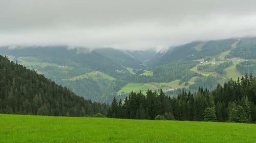 Landscape View of the Clouds Moving Over the Hills of the Alpine Mountains Timelapse