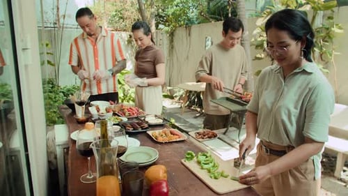 Friends Prepare Barbecue Together in Urban Setting