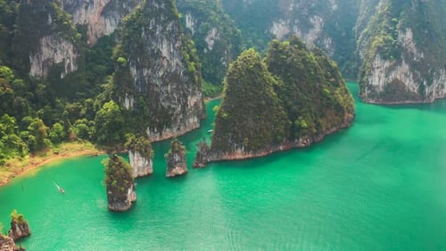 Three limestone rocks Three Brothers at Cheow Lan Lake, Khao Sok National Park, Surat Thani Province