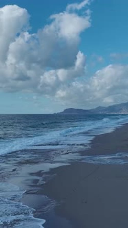 Vertical Video Aerial Perspective of a Mediterranean Sea Storm With Violent Waves and Foam Splashing