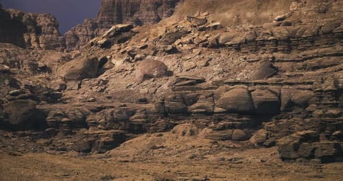 Barren Rocky Landscape with Layered Formations in a Desert Setting