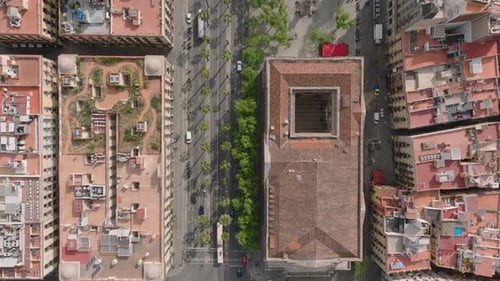 Top Down Panning Footage of Streets and Buildings in City on Sunny Day Vehicles Passing Road
