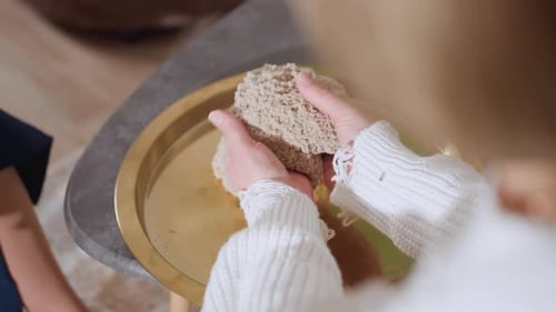 Mindful Guest Lifting Soft Wet Soil Mold During Sensory Therapy Session