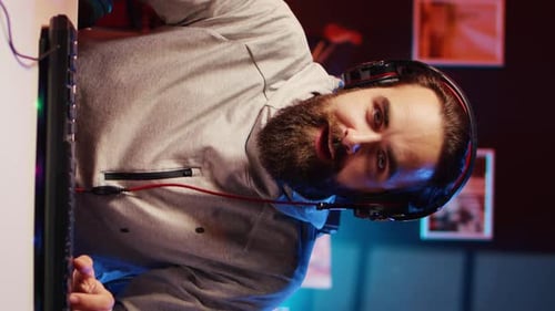 Man with Headphones Working at Desk Indoors