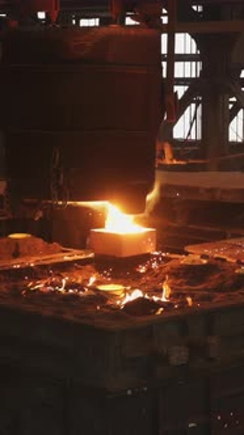 Foundry Worker Pouring Molten Metal Into Mold Stock Clip