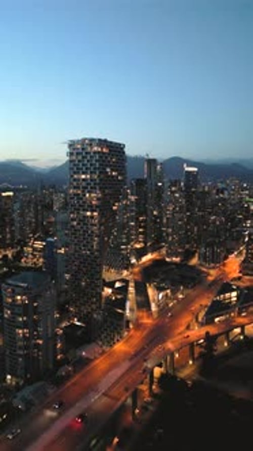Downtown of Vancouver at Night Skyscrapers and Traffic on the Roads