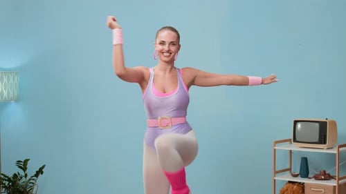 Woman Doing Aerobics in Retro Workout Gear