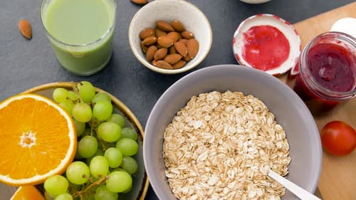 Food, Healthy Eating And Breakfast Concept - Oatmeal Cereals, Fruits And Vegetables, Green Smooth...