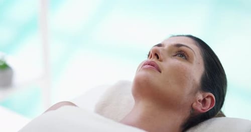 Woman Relaxing on Spa Bed for Beauty Treatment