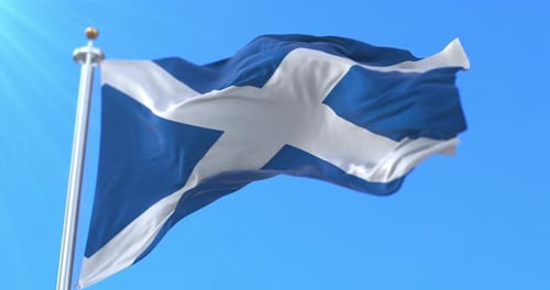 Waving Scotland Flag Against a Clear Blue Sky