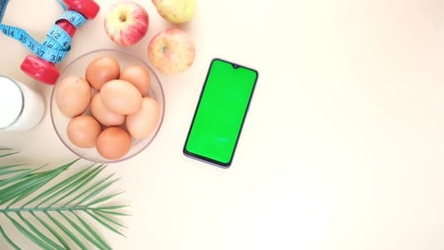Health and Fitness Flat Lay with Green Screen Phone