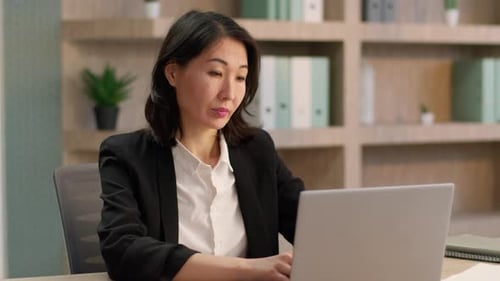 Business Woman Works at Computer in Modern Office