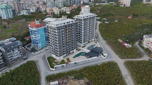 Aerial Video Dramatic Cloudy Sky Behind a Modern Complex Facade Perfect Architectural Scene
