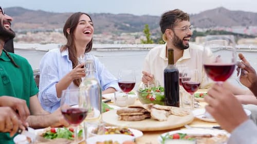 Friends Enjoying Meal Together at Outdoor Urban Table