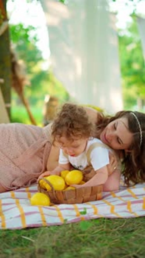 Mother and Child Have Fun With Lemons
