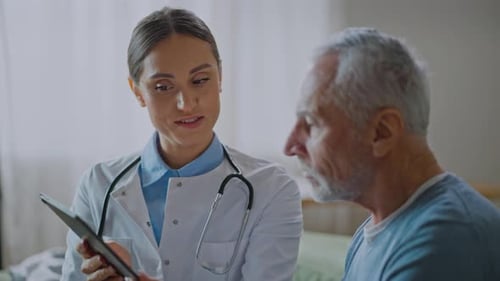 Female Doctor Explains Results to Senior Patient