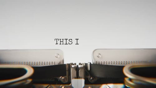 Old mechanical typewriter typing This Is Not The End in a close-up view.