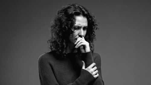 Woman Looking Anxious and Worried in Black and White