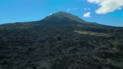 Aerial View of a Black Solidified Lava Flows Around an Active Volcano Mount Batur Bali Indonesia