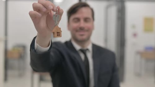 Close Up of Home Keys in Real Estate Agent Hand