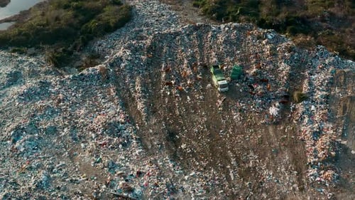 Aerial View of Garbage Pile in Trash Dump Dump Track Unload Waste at Landfill Biohazard for