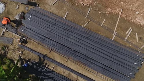 Aerial View Workers Lay Metal Reinforcement for Foundation