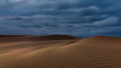 Timelapse of Dramatic Clouds Over the Sand Dunes in the Desert Sahara Desert